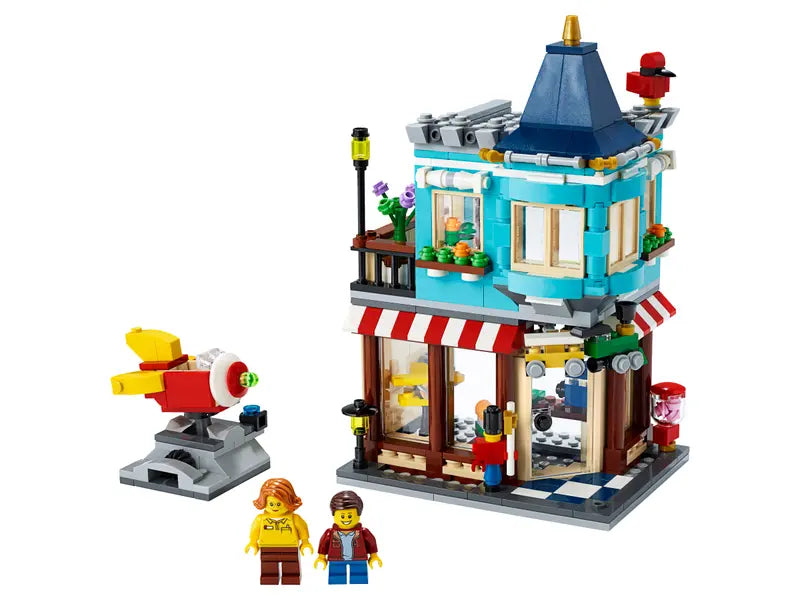 LEGO Creator 31105 Townhouse Toy Store Cake Shop Florist Building Set, 554 Pcs