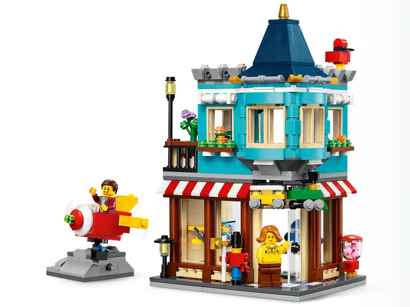 LEGO Creator 31105 Townhouse Toy Store Cake Shop Florist Building Set, 554 Pcs