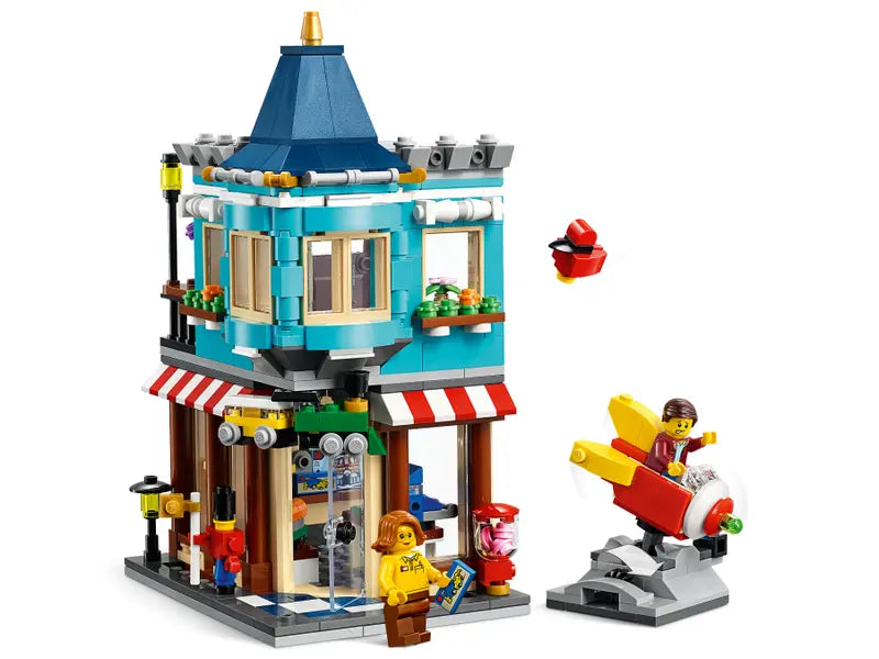 LEGO Creator 31105 Townhouse Toy Store Cake Shop Florist Building Set, 554 Pcs